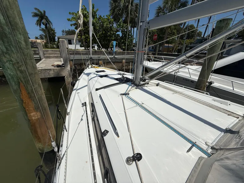 Slide: The Image of 2017 Beneteau Oceanis 41.1 sailboat docked, showcasing deck and rigging. - 26