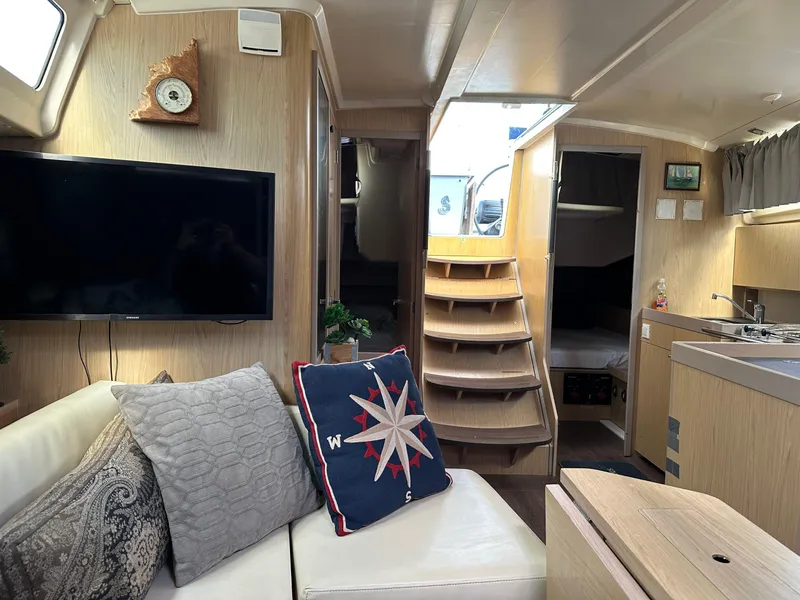 Slide: The Image of Interior of 2017 Beneteau Oceanis 41.1 yacht with cozy seating and modern amenities. - 3