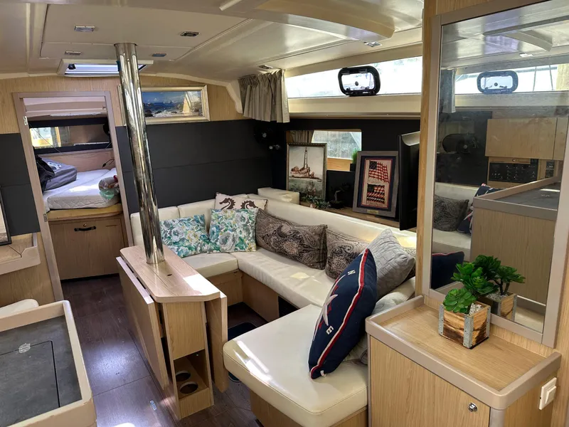 Slide: The Image of Interior of 2017 Beneteau Oceanis 41.1 yacht with cozy seating and modern decor. - 4