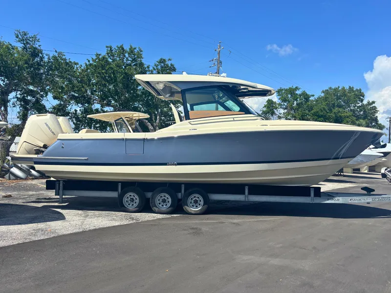The Image of 2025 Chris-Craft Calypso 32 boat docked, showcasing sleek design and modern features. - 0