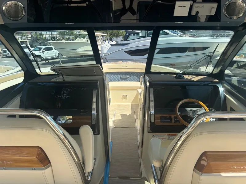 Slide: The Image of 2025 Chris-Craft Calypso 32 interior detail with elegant wood and leather finish. - 12