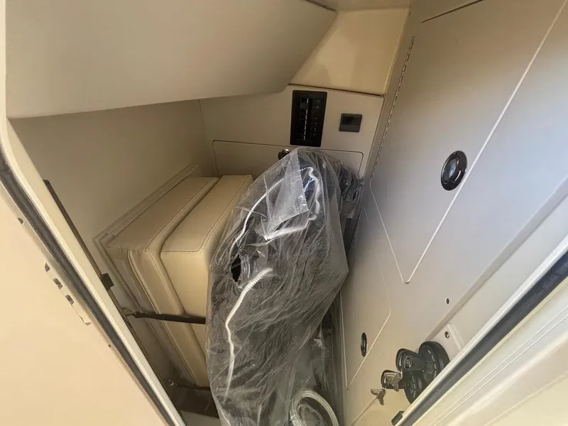 Slide: The Image of 2025 Chris-Craft Calypso 32 boat bathroom with sink, toilet, and mirror. - 17