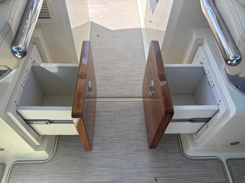 Slide: The Image of 2025 Chris-Craft Calypso 32 interior storage area with wrapped seating. - 18