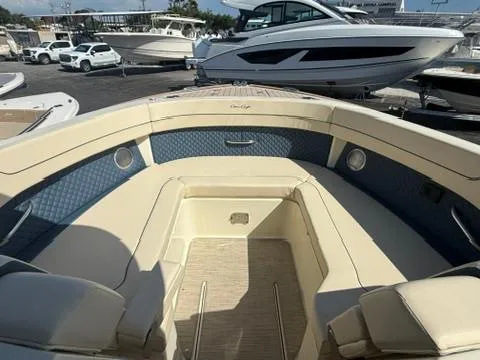 Slide: The Image of 2025 Chris-Craft Calypso 32 boat interior storage compartment with carpeted flooring. - 21