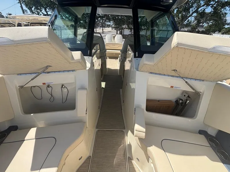 Slide: The Image of 2025 Chris-Craft Calypso 32 boat interior with open storage compartments. - 23
