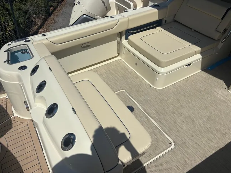 Slide: The Image of 2025 Chris-Craft Calypso 32 with twin Mercury engines, featuring a spacious deck layout. - 5