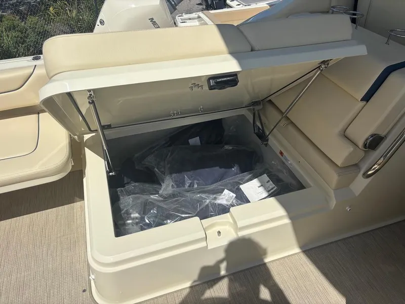 Slide: The Image of 2025 Chris-Craft Calypso 32 boat interior with beige seating and cup holders. - 6