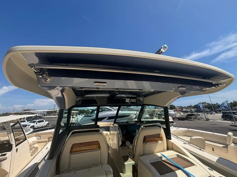 Slide: The Image of 2025 Chris-Craft Calypso 32 boat interior with kitchenette and storage compartments. - 9