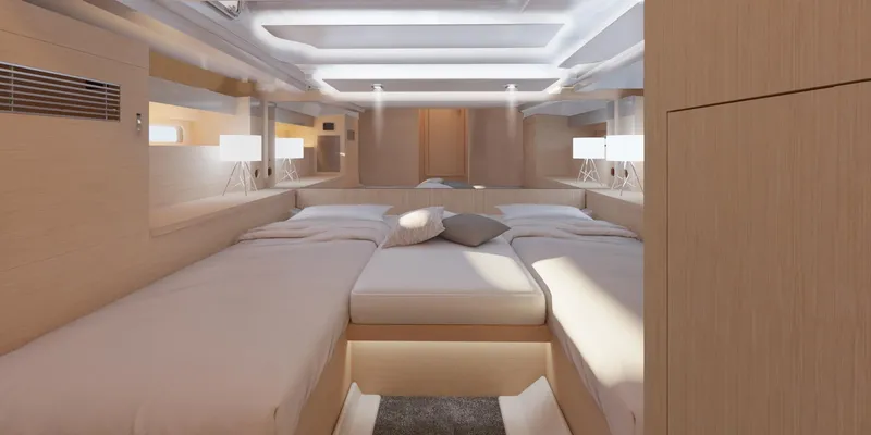 Slide: The Image of Luxurious interior of 2024 Jeanneau DB 37 OB yacht with modern bedding and ambient lighting. - 6