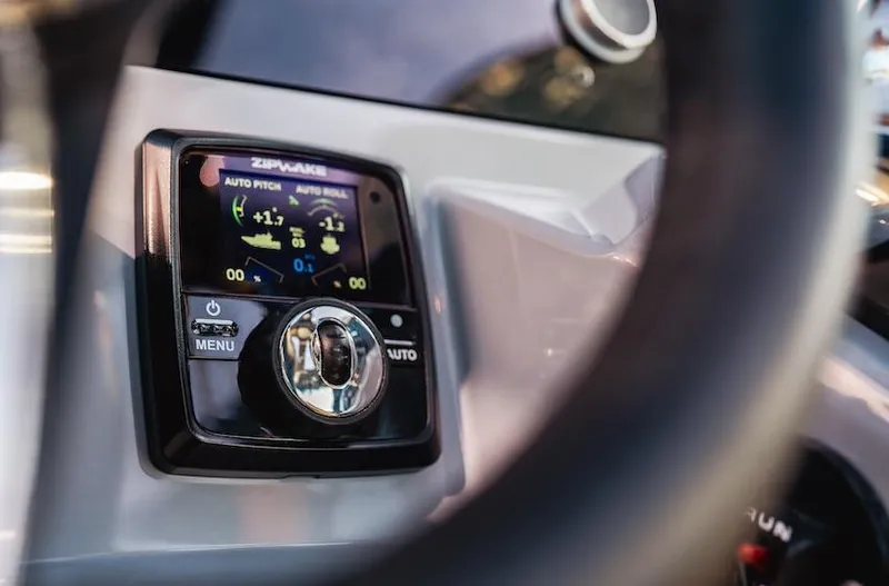 Slide: The Image of Control panel of 2025 Navan S30 boat, featuring digital display and navigation controls. - 13