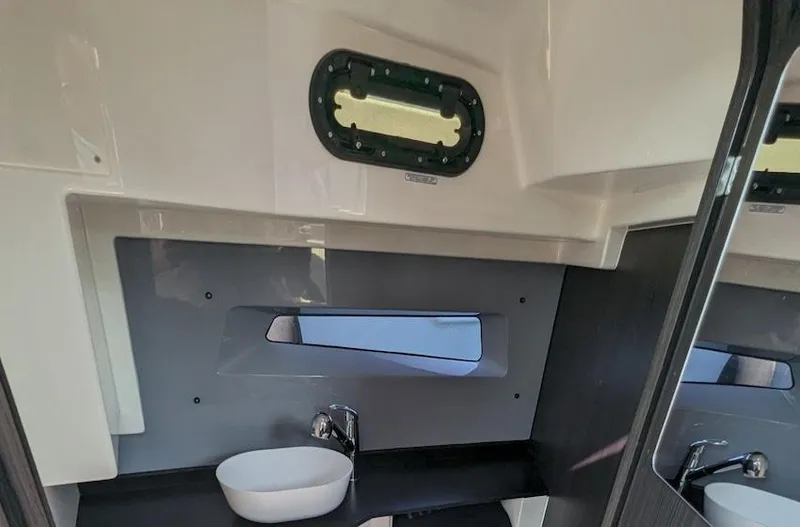 Slide: The Image of Modern bathroom interior of 2025 Navan S30 with sleek sink and window. - 19