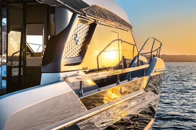 Slide: The Image of Luxury Prestige F4.9 yacht at sunset, 2025 model, reflecting golden hues on water. - 13