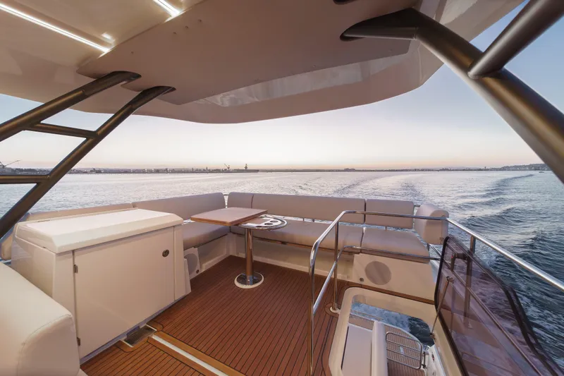 Slide: The Image of Luxurious Prestige F4.9 yacht deck, 2025 model, with elegant seating and ocean view. - 16