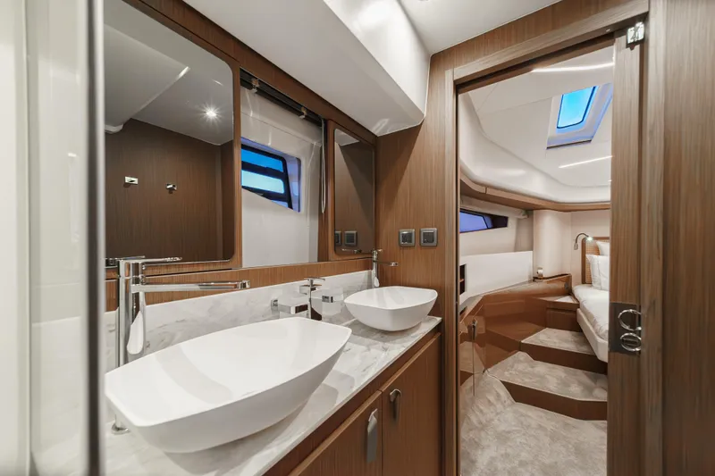 Slide: The Image of Luxurious bathroom and bedroom interior of 2025 Prestige F4.9 yacht, featuring modern design elements. - 18