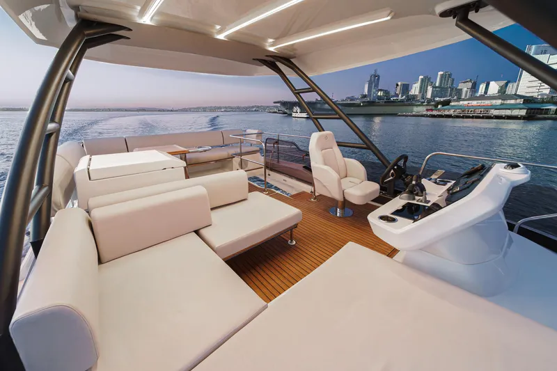 Slide: The Image of Luxurious 2025 Prestige F4.9 yacht interior with modern seating and cityscape view. - 22