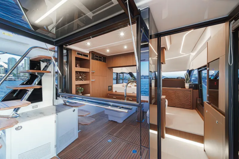 Slide: The Image of Luxurious interior of 2025 Prestige F4.9 yacht with modern design and waterfront view. - 27