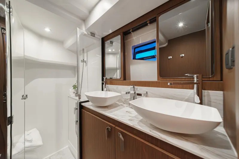 Slide: The Image of Luxurious bathroom in 2025 Prestige F4.9 yacht with dual sinks and modern fixtures. - 33