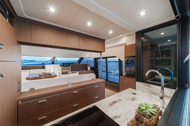Slide: The Image of Luxurious interior of 2025 Prestige F4.9 yacht with modern kitchen and ocean view. - 36