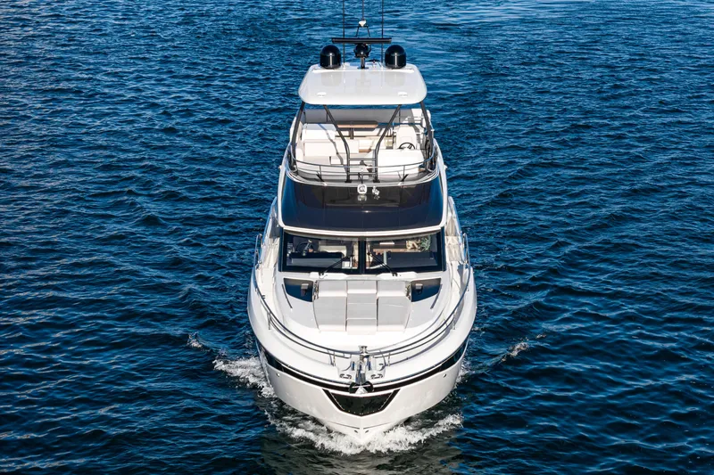 Slide: The Image of Luxurious 2025 Prestige F4.9 yacht cruising on open water. - 37