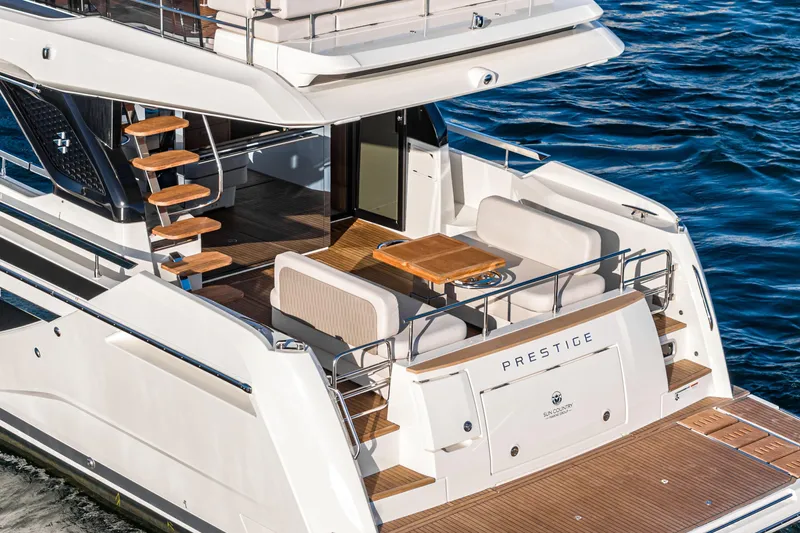 Slide: The Image of Luxurious 2025 Prestige F4.9 yacht with elegant deck and seating area on the water. - 39