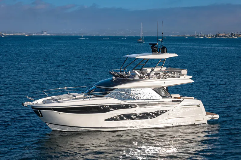 Slide: The Image of Luxurious 2025 Prestige F4.9 yacht cruising on serene blue waters. - 42