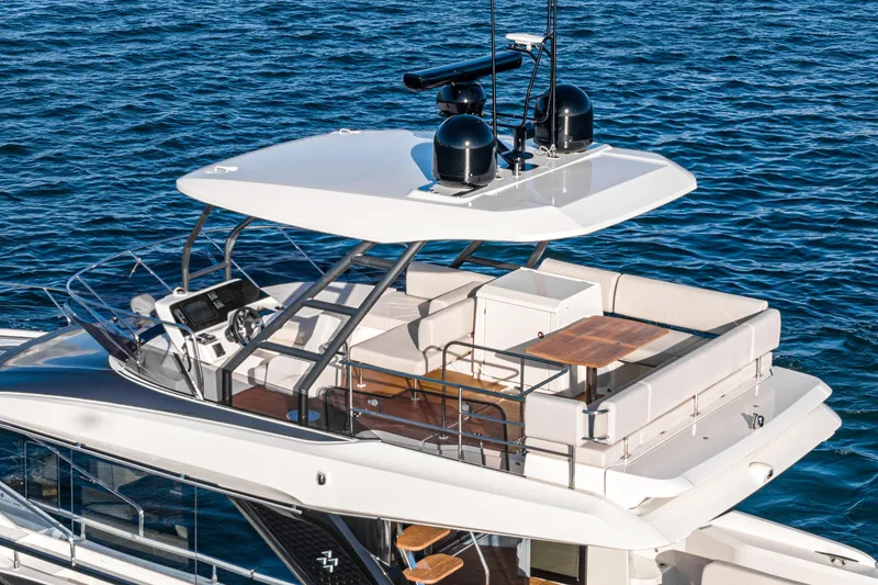 Slide: The Image of Luxury Prestige F4.9 yacht, 2025 model, with spacious deck and modern design on blue water. - 5