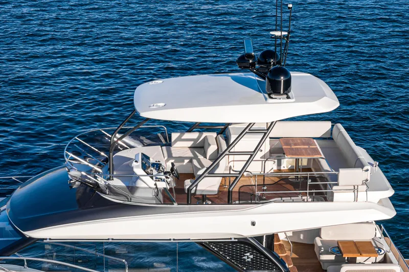 Slide: The Image of Luxurious 2025 Prestige F4.9 yacht with spacious deck and modern design on blue ocean. - 6