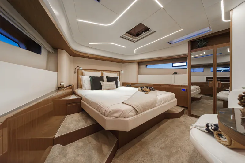 Slide: The Image of Luxurious 2025 Prestige F4.9 yacht bedroom with modern design and ambient lighting. - 7