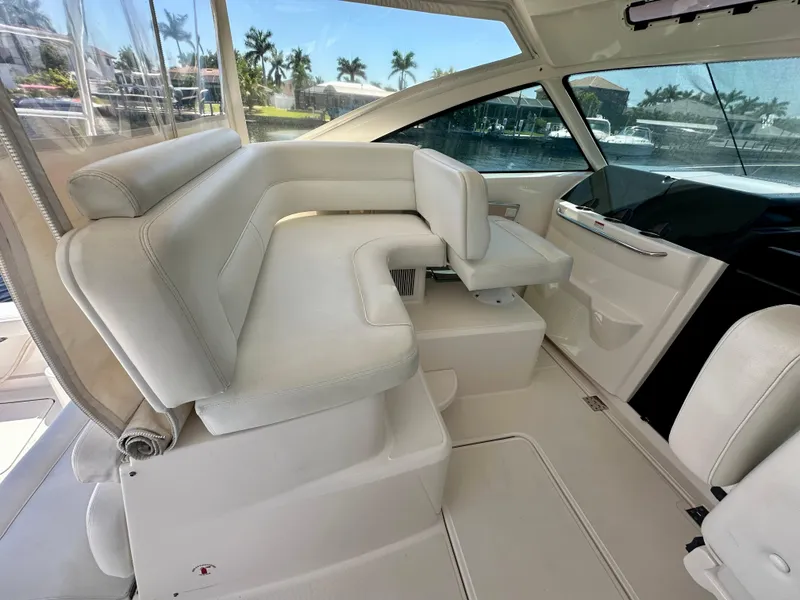 Slide: The Image of Luxurious interior seating of 2018 Tiara Yachts 4300 Open, featuring elegant white upholstery. - 18