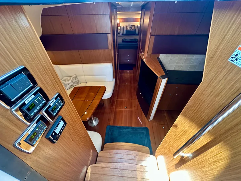 Slide: The Image of Interior of 2018 Tiara Yachts 4300 Open, featuring wood finishes and modern amenities. - 22