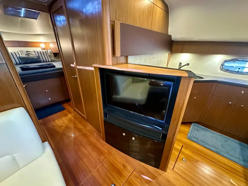 Slide: The Image of Luxurious interior of 2018 Tiara Yachts 4300 Open with wood finishes and modern amenities. - 28