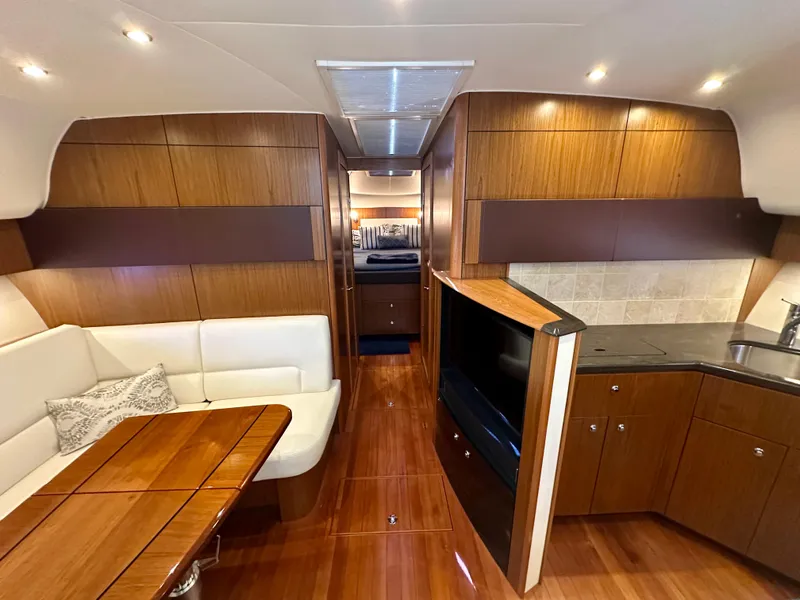 Slide: The Image of Luxurious interior of 2018 Tiara Yachts 4300 Open with wood finish and modern amenities. - 29