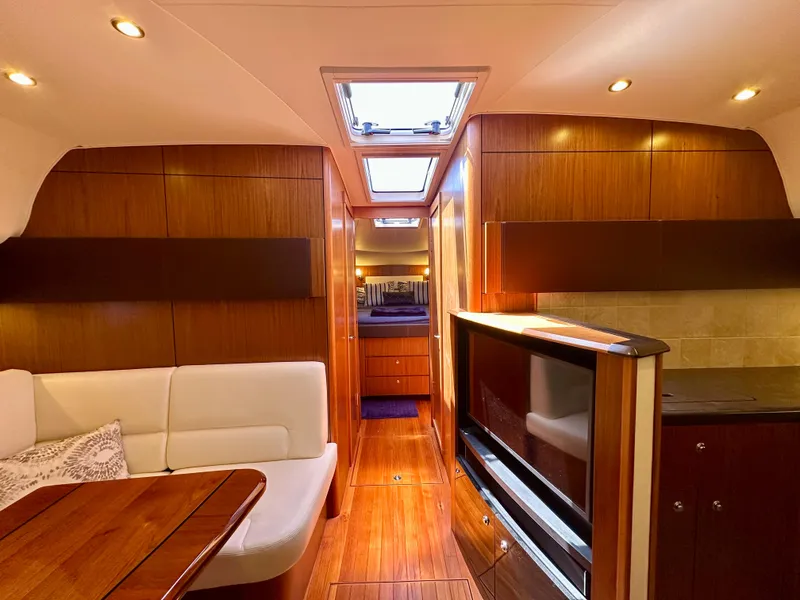 Slide: The Image of Luxurious interior of 2018 Tiara Yachts 4300 Open with wood finish and modern amenities. - 30