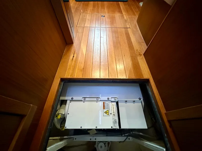 Slide: The Image of 2018 Tiara Yachts 4300 Open interior with wooden flooring and open hatch. - 34