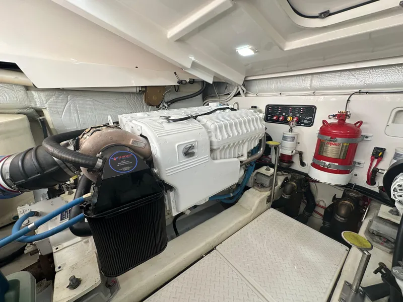 Slide: The Image of Engine room of 2018 Tiara Yachts 4300 Open, featuring machinery and safety equipment. - 37