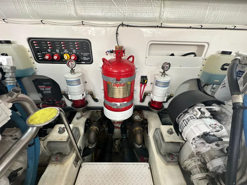 Slide: The Image of Engine room of 2018 Tiara Yachts 4300 Open with fire suppression system and control panel. - 39