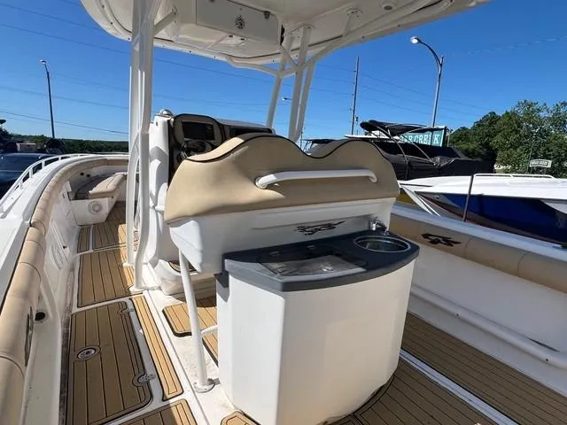 Slide: The Image of 2016 Glasstream 360 SCX boat interior with helm and seating area. - 10