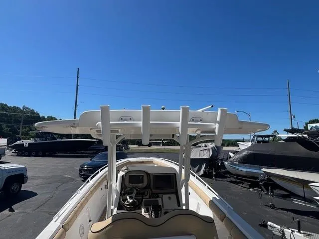 Slide: The Image of 2016 Glasstream 360 SCX boat, view of helm and T-top, parked outdoors under clear blue sky. - 11