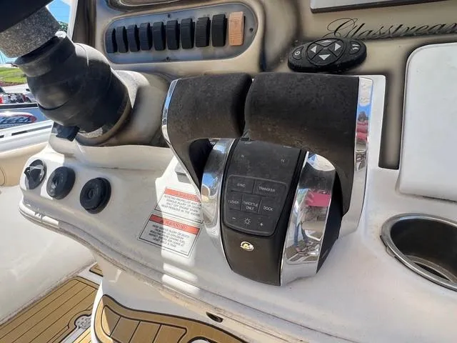 Slide: The Image of Control panel of a 2016 Glasstream 360 SCX boat with throttle and switches. - 14