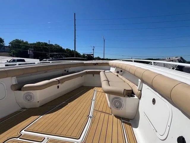 Slide: The Image of 2016 Glasstream 360 SCX boat with tan seating and wood-style deck. - 16