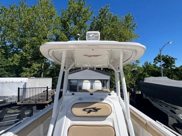 Slide: The Image of 2016 Glasstream 360 SCX boat with canopy, docked outdoors under clear blue sky. - 18