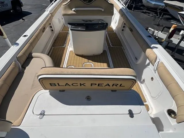 Slide: The Image of 2016 Glasstream 360 SCX boat interior with "Black Pearl" seating and wood-style flooring. - 7