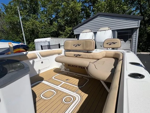Slide: The Image of 2016 Glasstream 360 SCX boat interior with tan seating and wood-patterned flooring. - 9