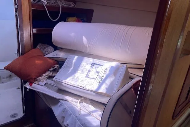 Slide: The Image of Interior of 1999 Hunter Passage 420 yacht with cushions and bedding. - 14