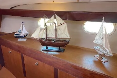 Slide: The Image of Model sailboats displayed inside a 1999 Hunter Passage 420 yacht. - 17