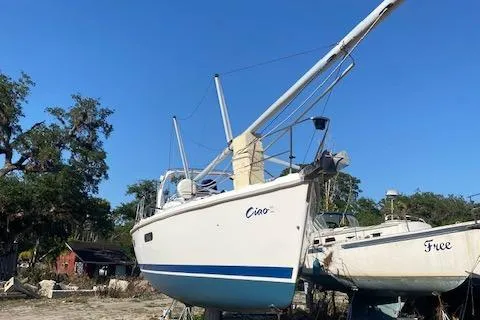 Slide: The Image of 1999 Hunter Passage 420 sailboat on land, clear blue sky background. - 3