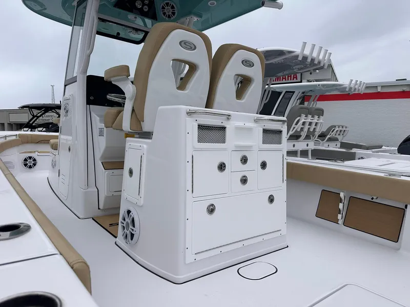 Slide: The Image of 2024 Sportsman Masters 267OE Bay Boat with dual seats and storage compartments. - 15