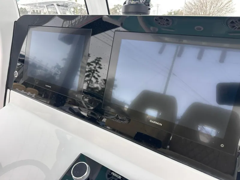Slide: The Image of 2024 Sportsman Masters 267OE Bay Boat dashboard with dual Garmin displays. - 27