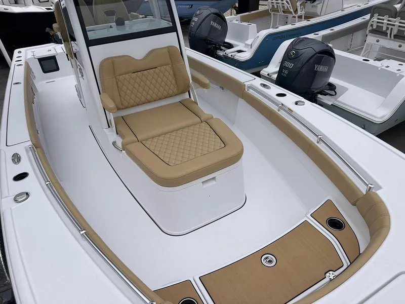 Slide: The Image of 2024 Sportsman Masters 267OE Bay Boat with tan seating and Yamaha engines. - 32