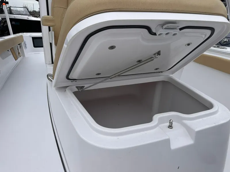 Slide: The Image of 2024 Sportsman Masters 267OE Bay Boat storage compartment with open lid. - 35